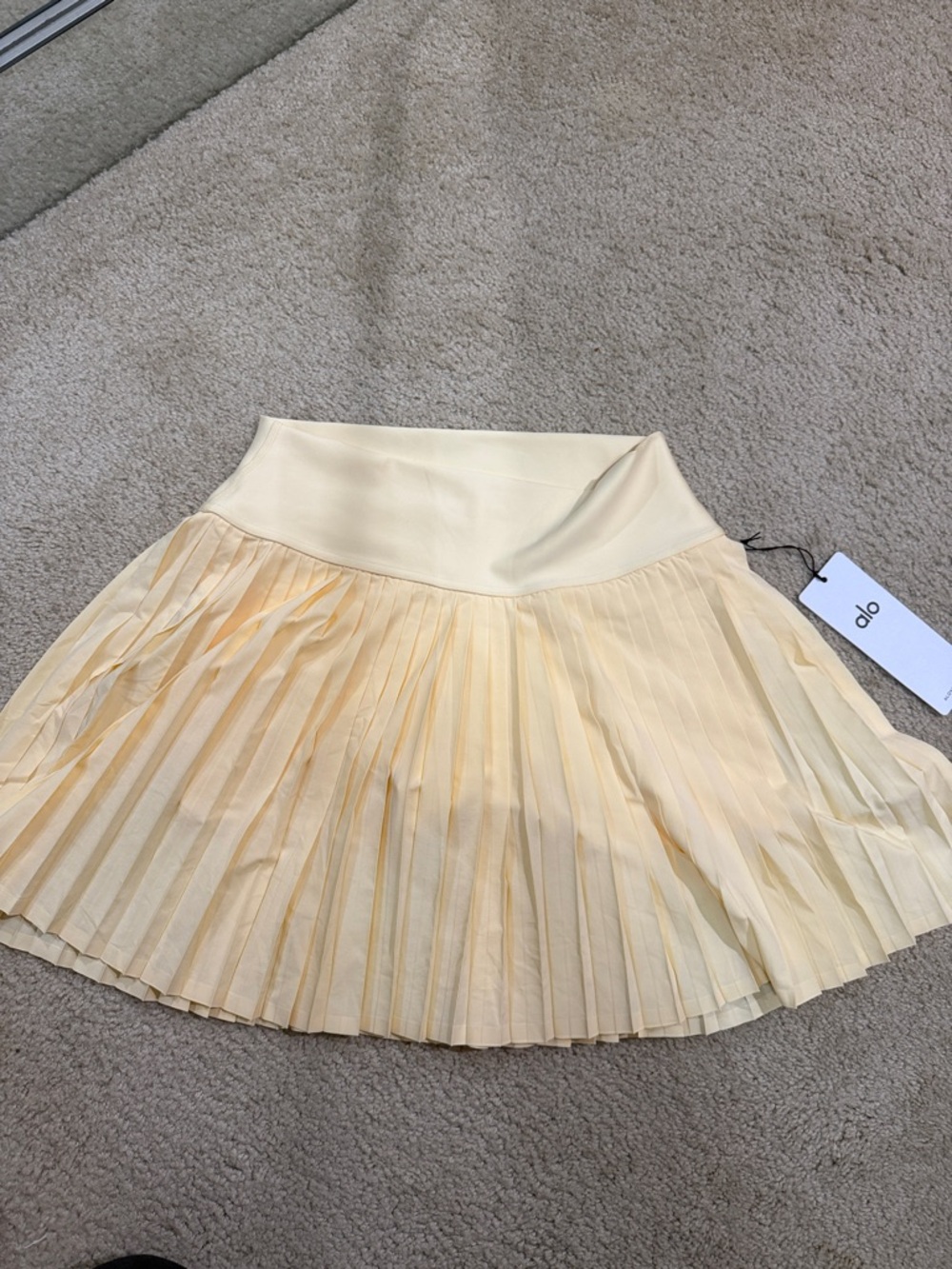 ALO Yoga Pleated Skater Mini Skirt in Soft Yellow